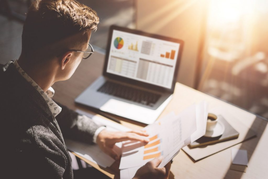 Finance market analyst in eyeglasses.
