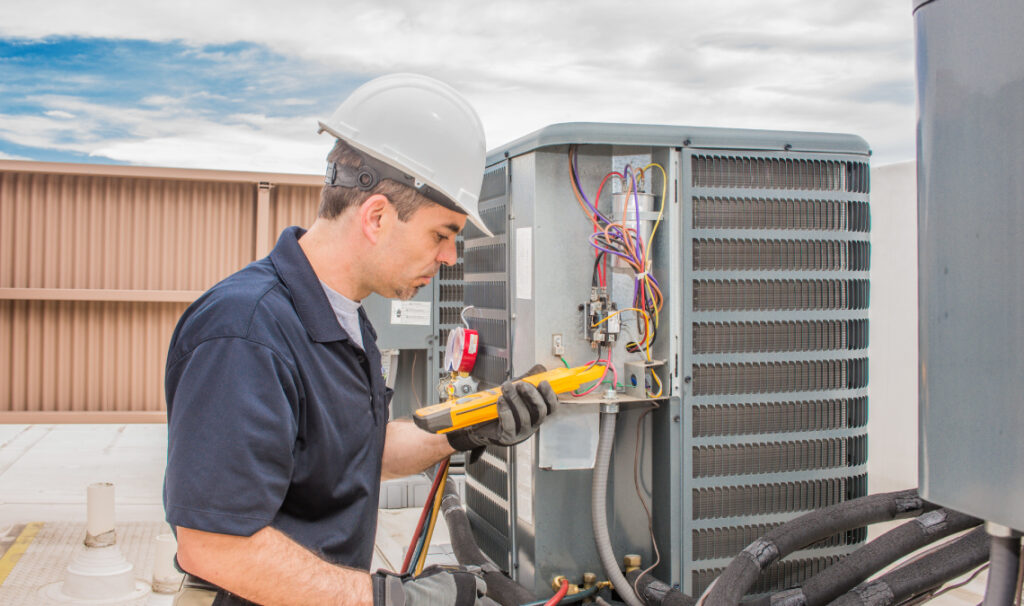 HVAC technician fixing a unit.