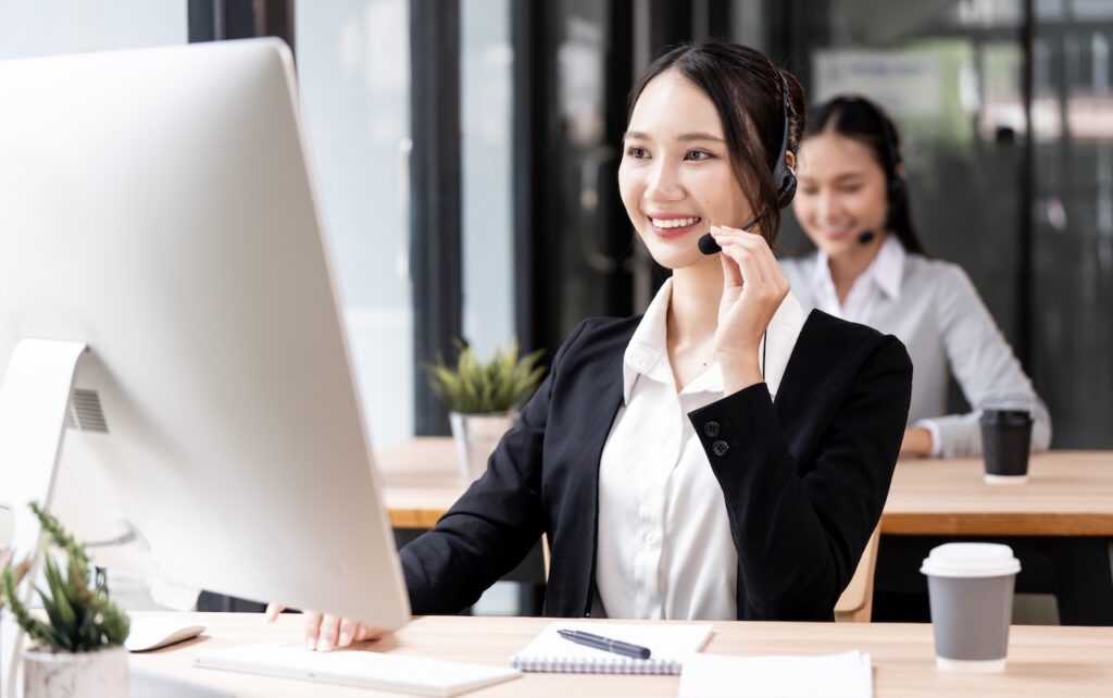 employee talking on phone in office of business